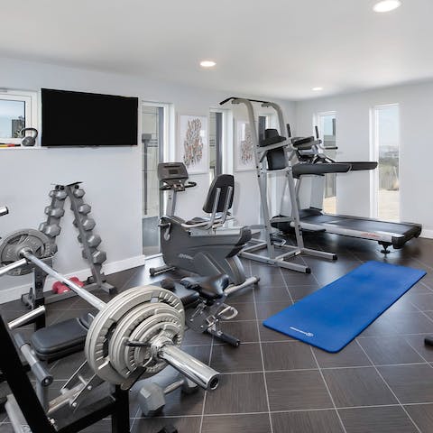 Keep up with your fitness routine in the well-equipped home gym