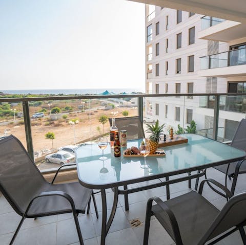 Take a seat out on the balcony and gaze out at Achziv Beach