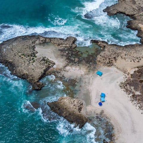 Drive over to Israel's rugged coastline in five minutes and paddle in the sea
