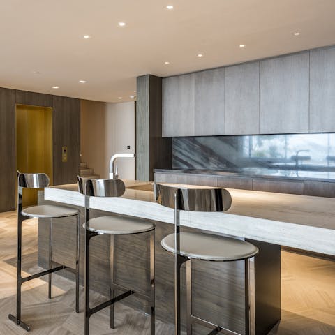 Work, eat, cook (or watch someone else cook) in the sleek kitchen