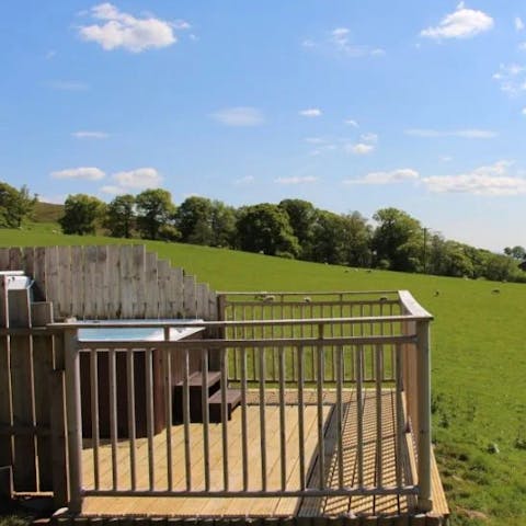 Soak up the views of the fells and reservoir from your private hot tub