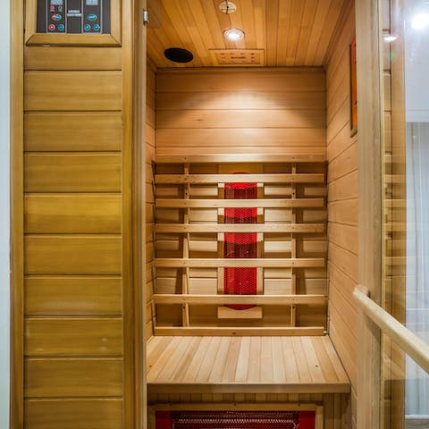 Relax sore muscles with a steam in the private two-person sauna