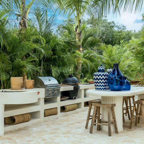 Grill up some good food with the barbecue and luxurious outdoor kitchen area