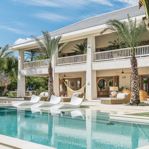 Lounge by the salt water infinity pool on one of the six sun loungers, three water loungers or multiple hammocks