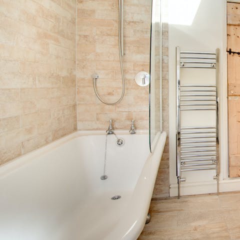 Take a relaxing soak in the roll-top bath 