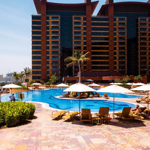 Hang out by the communal pool on scorching afternoons