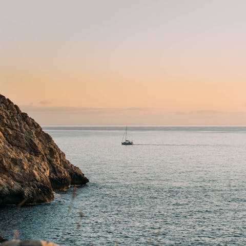 Watch the sunset from Marçal Beach, a short car ride from the villa