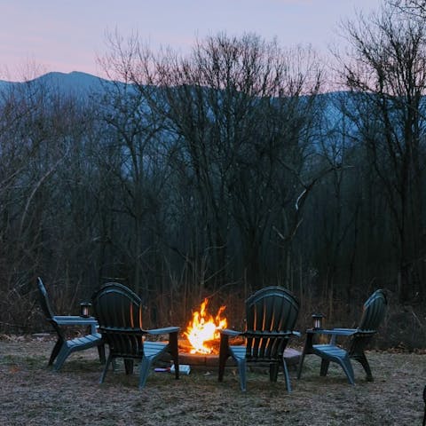 Gather around the fire pit underneath the starry sky