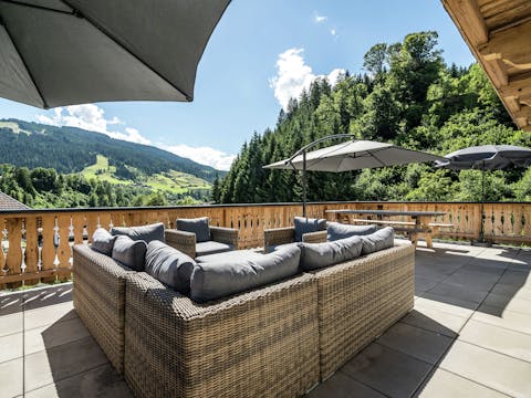 Flop down on the outdoor sofa and admire the view from the balcony