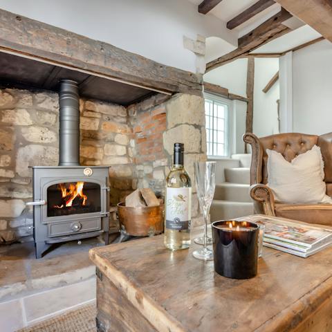 Get cosy on the arm chair while sipping wine beside the fire