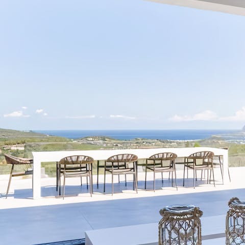 Gather for barbecue dinners while enjoying the sea view