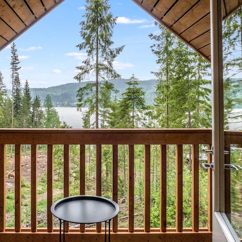 Gaze across the trees to the lake from your balcony – it's just around 200 metres to the shore