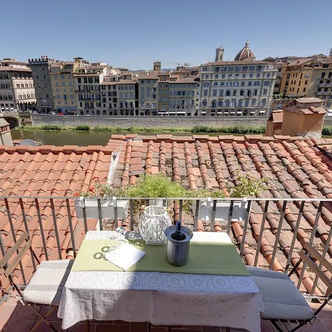 Sip your morning espresso on the balcony overlooking the Arno River