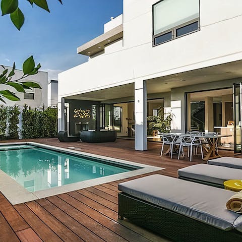 Lounge under the sun after a morning swim in the private pool