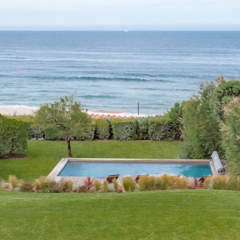 Admire the beachfront views from the private pool