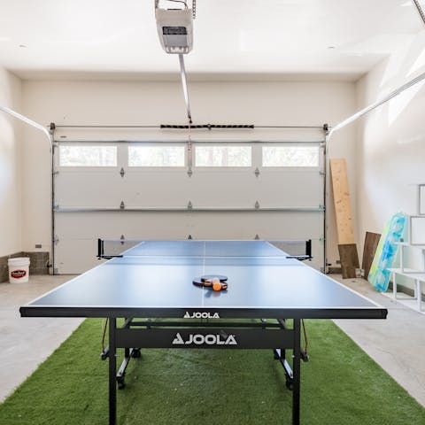 Play back-to-back games of table tennis in the garage