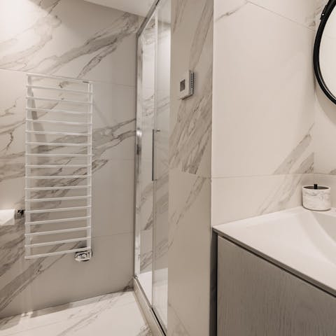 Pamper yourself in the swish marble bathroom with its luxurious rainfall shower