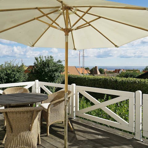 Make a toast on the balcony with a chilled local beer and sea views