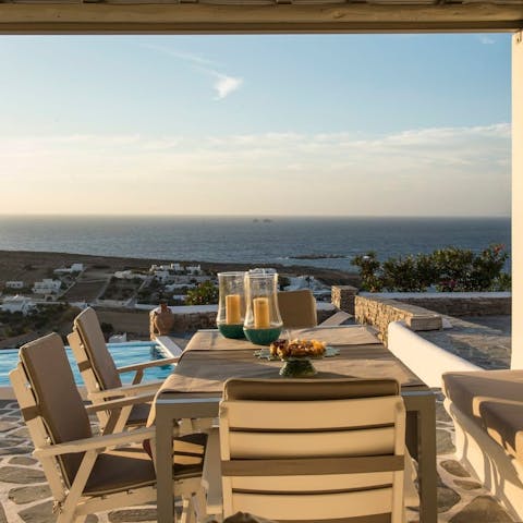 Dine on the shaded pergola while enjoying expansive ocean views