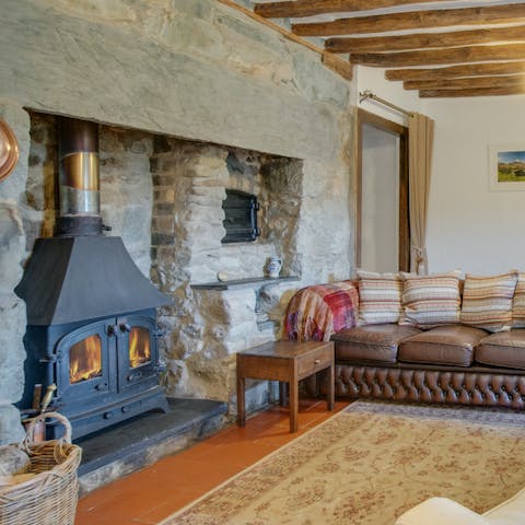 Light a fire in the wood-burning stove in the home's old hearth