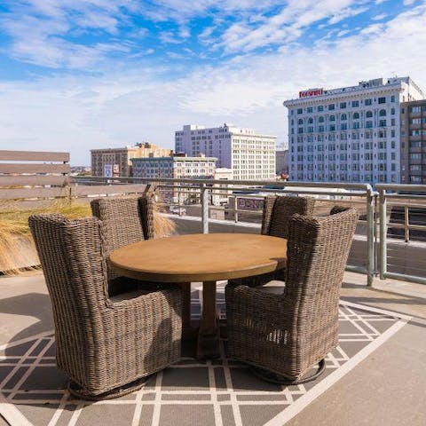 Have your morning coffee on the communal roof terrace, with the panorama of the city before you