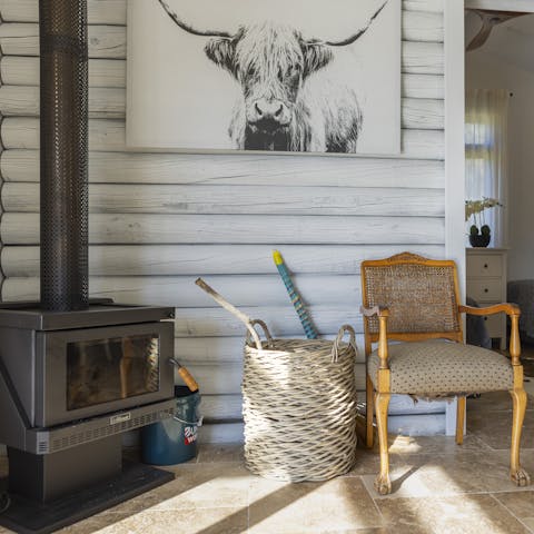 Curl up in front of the wood burner in this rustic home