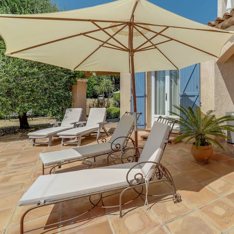 Soak up the Mediterranean sunshine on the loungers 