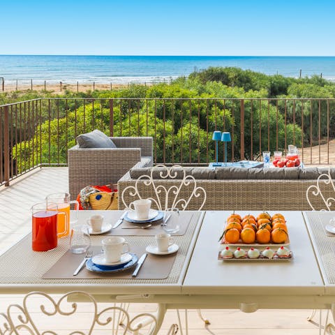 Enjoy breakfast with a view on the sea-facing terrace