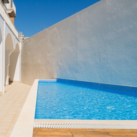 Soak up some rays in the communal pool