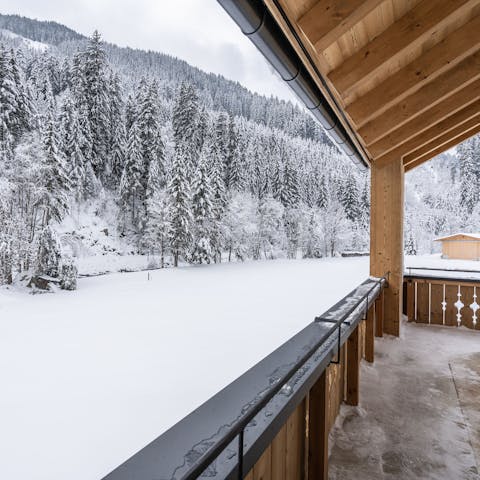 Get a burst of fresh Alpine air out on the chalet's balcony