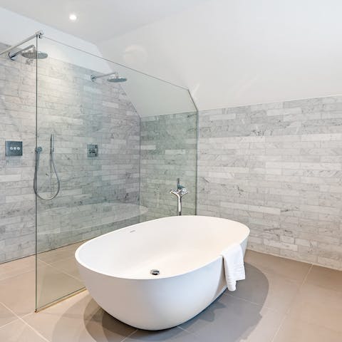 Treat yourself to an indulgent soak in the apartment's elegant bathtub