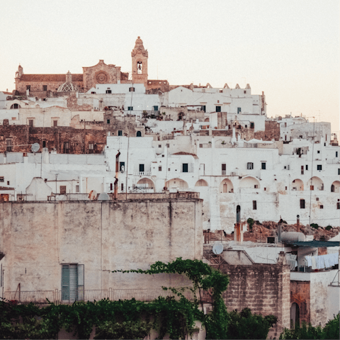 Explore the narrow streets and historic courtyards of Ostuni