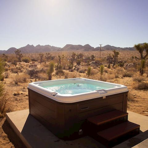 Unwind in the hot tub surrounded by a striking desert landscape