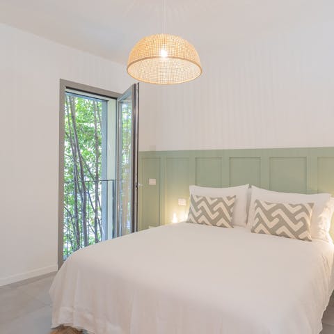 Enjoy leafy views across the surrounding trees from the bedroom 