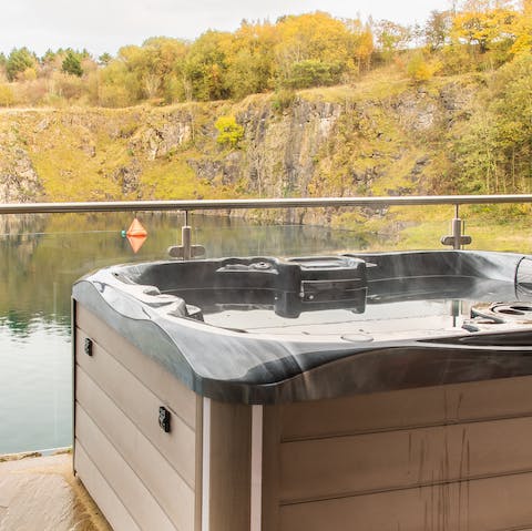Relax in your private hot tub with lake views