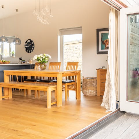 Open the bi-folding doors to bring the outdoors in 