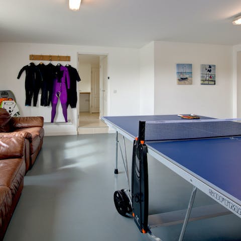 A games room, with space to hang up your wetsuits