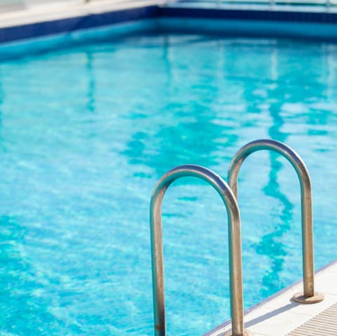 Head up to the communal rooftop swimming pool for an afternoon float