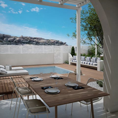 Dine alfresco beneath the pergola and admire views of the island 