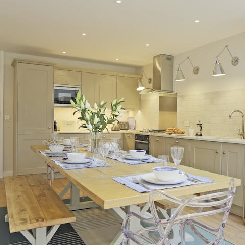 Gather together for a family meal in the bright kitchen