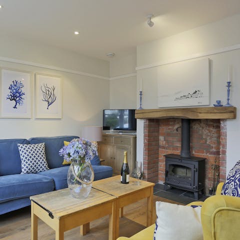 Enjoy a cosy night warmed by the exposed brick fireplace