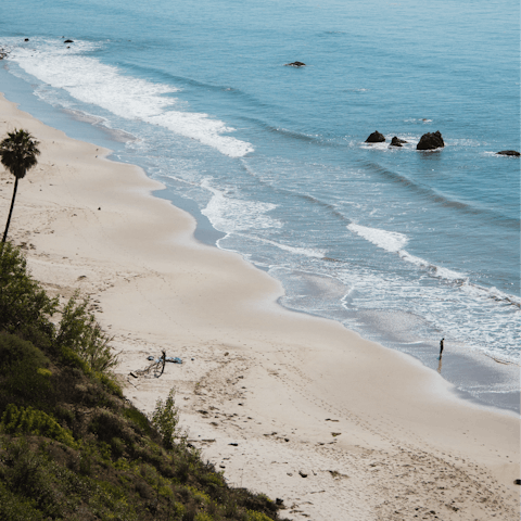 Go surfing on Malibu Beach or explore nearby Santa Monica