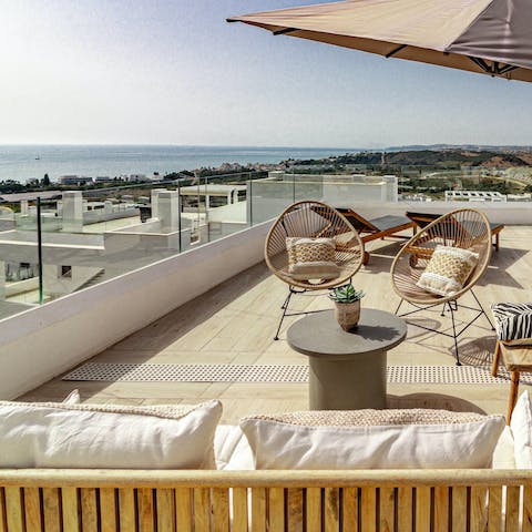 Laze around in front of the breathtaking views from the terrace lounge
