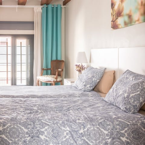 Get some rest in the bedroom after a busy day sightseeing in Barcelona
