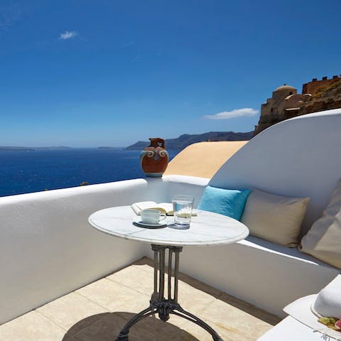 Embrace the breathtaking views from the balcony - don't forget your book