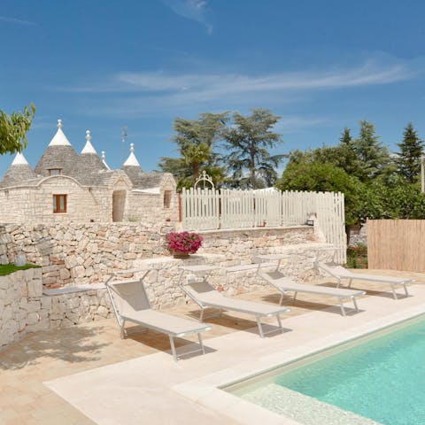 Sunbathe by the pool after enjoying an Italian breakfast of frittatas in your trulli