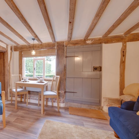 Admire original, rustic features like the wooden door and beams