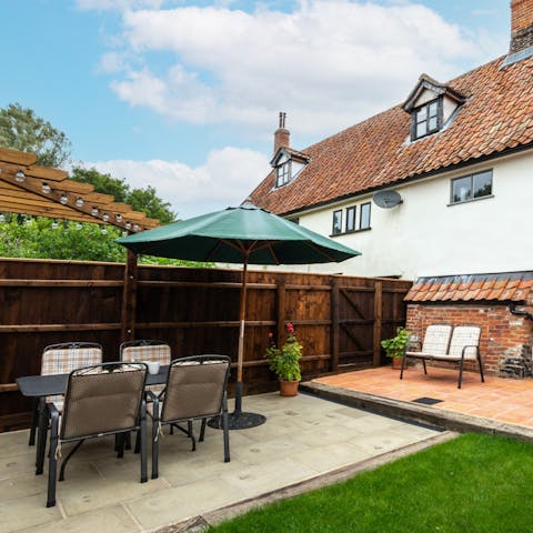 Dine alfresco on the patio in your private garden