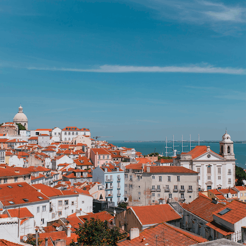 Head to nearby Miradouro das Portas do Sol for postcard views of Lisbon 