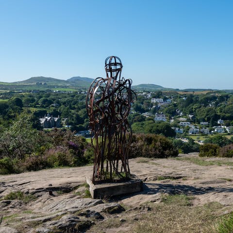 Roam the coastal path and see the Welsh Tin Man statue overlooking the sea 